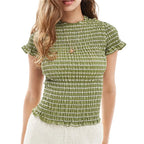 Women's green smocked peplum top for casual summer outings