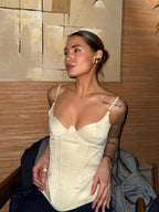 Women's cream peplum top in stretchy material, perfect for casual outings