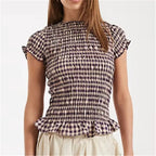 Women's peplum top in plaid, perfect for casual outings