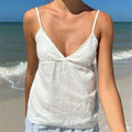 Women's white linen peplum top, perfect for beach outings