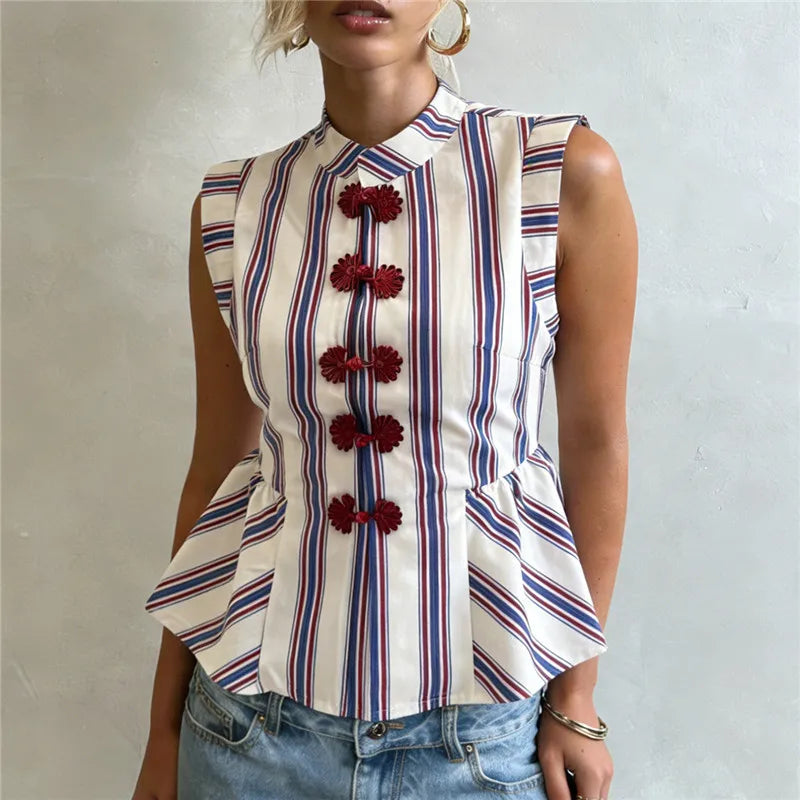 Women's striped peplum top with floral buttons, perfect for summer outings.