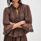 Women's brown peplum top with lace trim, perfect for casual outings