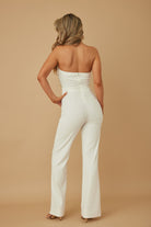 Chic white petal rhinestone jumpsuit featuring a strapless design and elegant fitted silhouette