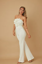 Stylish women’s petal rhinestone jumpsuit in white with floral detail, perfect for special occasions