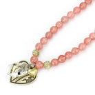Pink beaded heart pendant necklace by VacationGrabs featuring sparkling accents and a stylish design