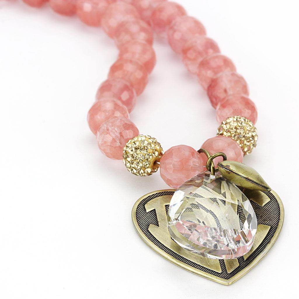 Pink beaded heart pendant necklace with sparkling crystal charm and gold accents for women