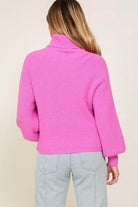Back view of a pink cozy fall sweater from Lumiere with relaxed fit and balloon sleeves