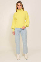 Lumiere yellow sweater with a turtleneck, perfect for layering this fall season