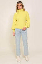 Lumiere yellow sweater with a turtleneck, perfect for layering this fall season