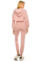 Back view of women's pink crop top and bottom set by Andante USA with stylish design and comfortable fit
