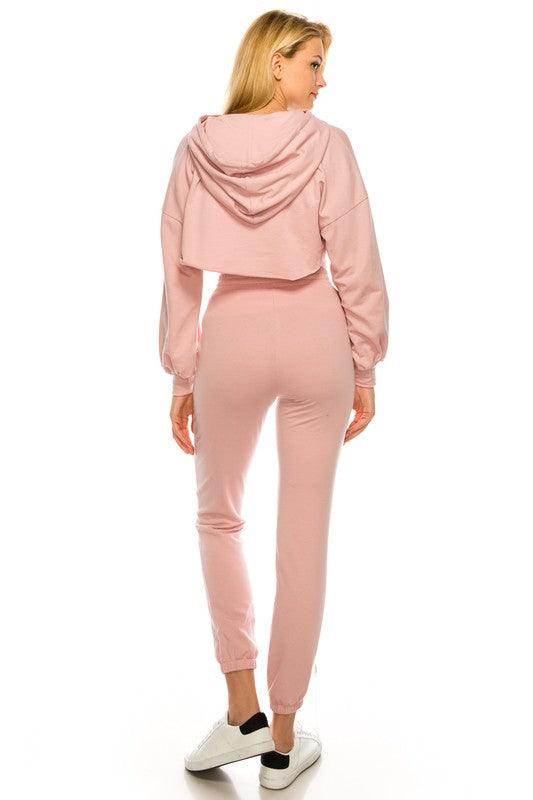 Back view of women's pink crop top and bottom set by Andante USA with stylish design and comfortable fit