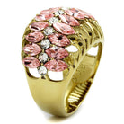 Stunning pink gemstone fashion ring with gold detailing and multiple sparkling stones