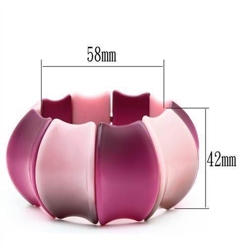 Pink resin statement bracelet with a wavy design, measuring 58mm in diameter and 42mm in width