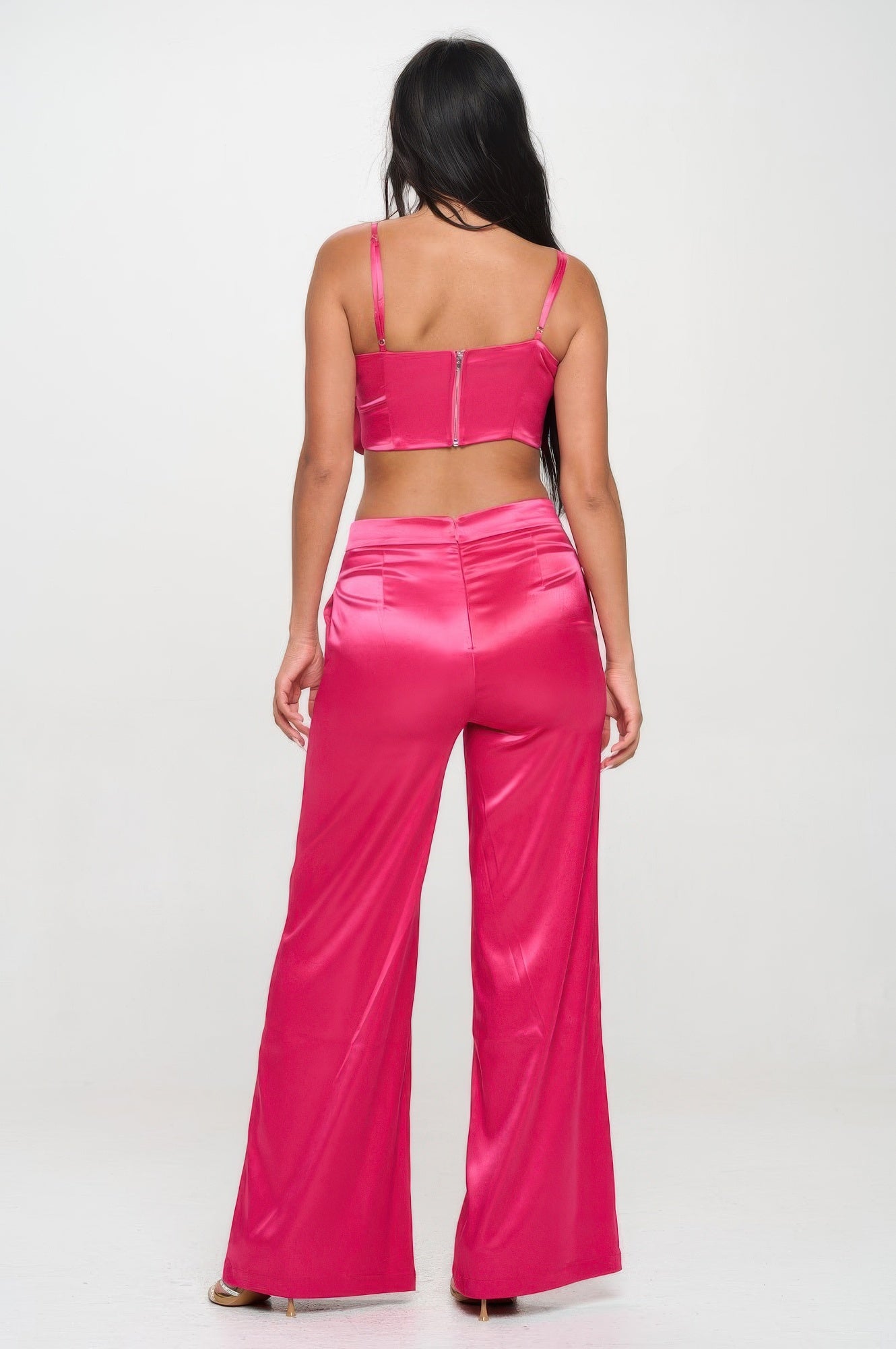 Back view of woman wearing pink satin crop top and wide leg pants set from VacationGrabs