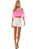 Stylish TCEC pintuck accent shorts in white, paired with a vibrant pink off-the-shoulder top