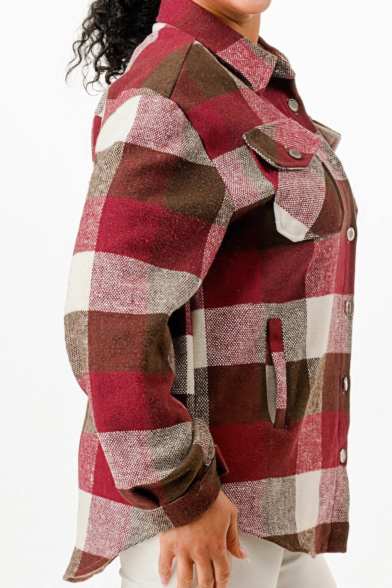 Plaid flannel shacket for women in red, brown, and white with button details and side pockets