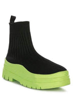 Women's black knit boots with platform in vibrant green for trendy street style