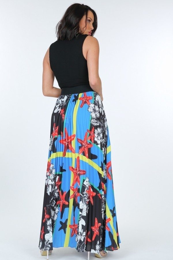 Woman wearing VacationGrabs pleated print maxi skirt with colorful starfish and floral patterns