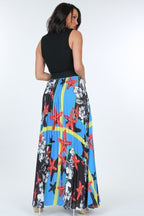 Woman wearing VacationGrabs pleated print maxi skirt with colorful starfish and floral patterns