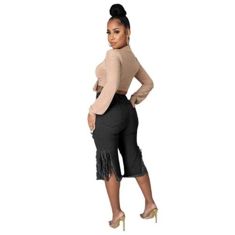 Plus size black denim shorts by By Claude with a stylish fringe hem for a chic summer look