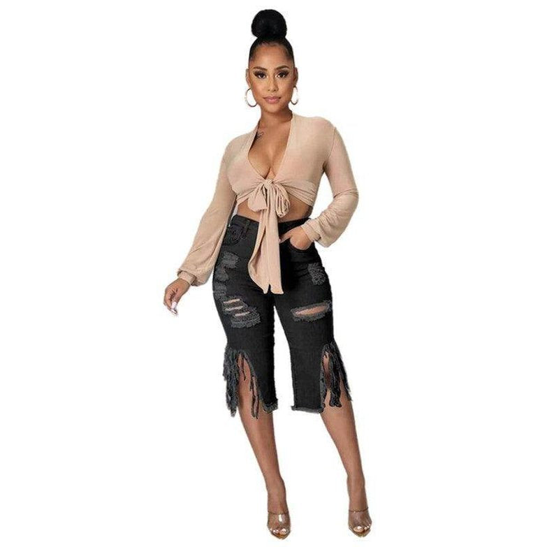 Stylish plus size black denim shorts with frayed hem and ripped details for trendy summer outfits
