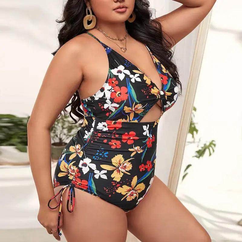 plus size floral swimsuit, black with colorful floral print, perfect for beach outings