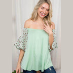 Light green plus size off shoulder top with animal print sleeves for a stylish summer look