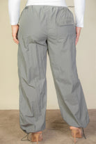 Back view of plus size parachute pants for women by VacationGrabs in grey with adjustable waist and pockets