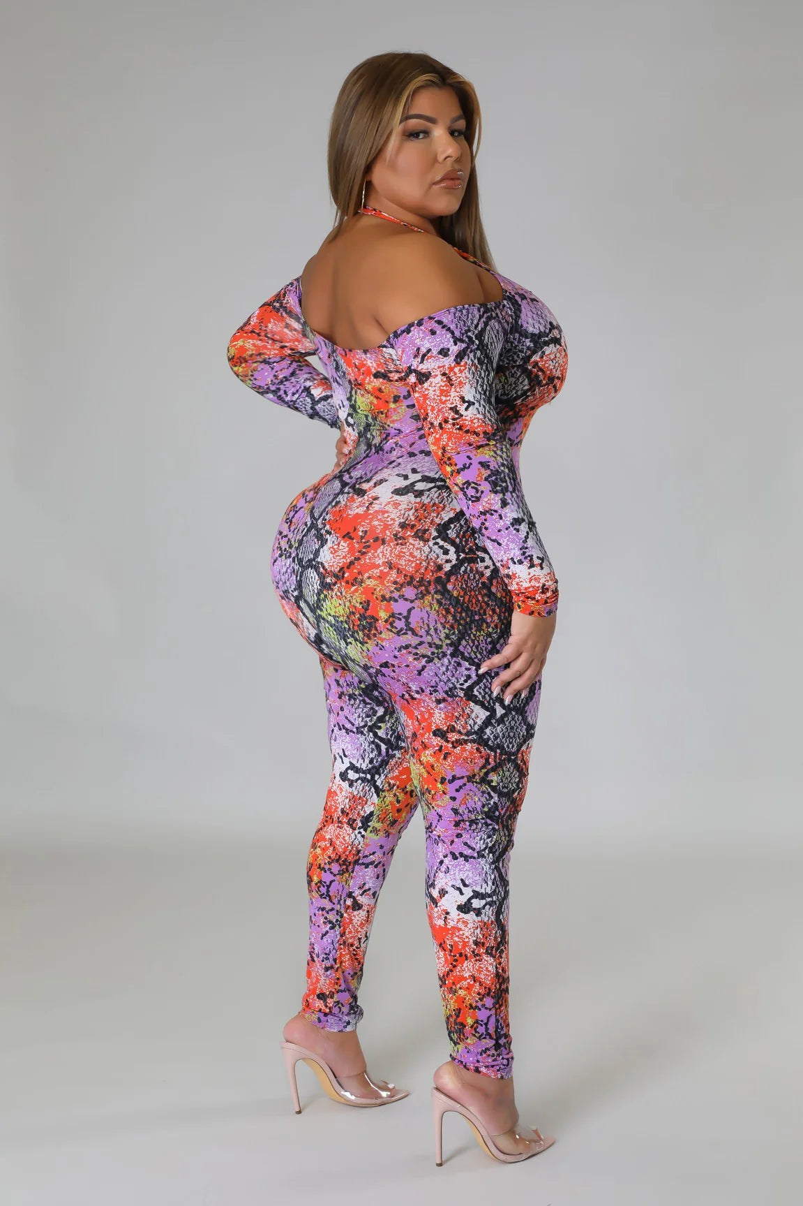 Plus size snake print jumpsuit with vibrant colors and off-shoulder design by VacationGrabs