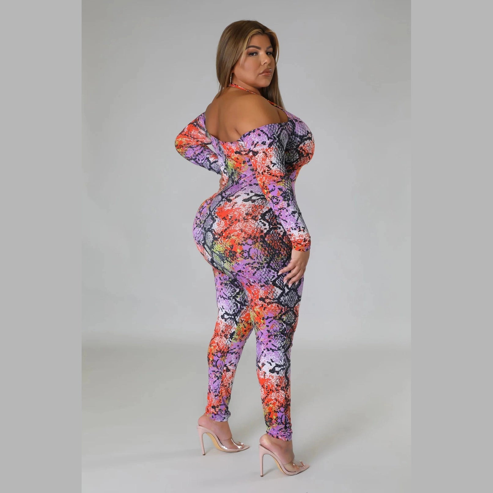 Plus size snake print jumpsuit with vibrant colors and off-shoulder design by VacationGrabs