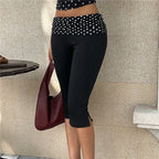 Women's black leggings with polka dot dots, perfect for casual outings