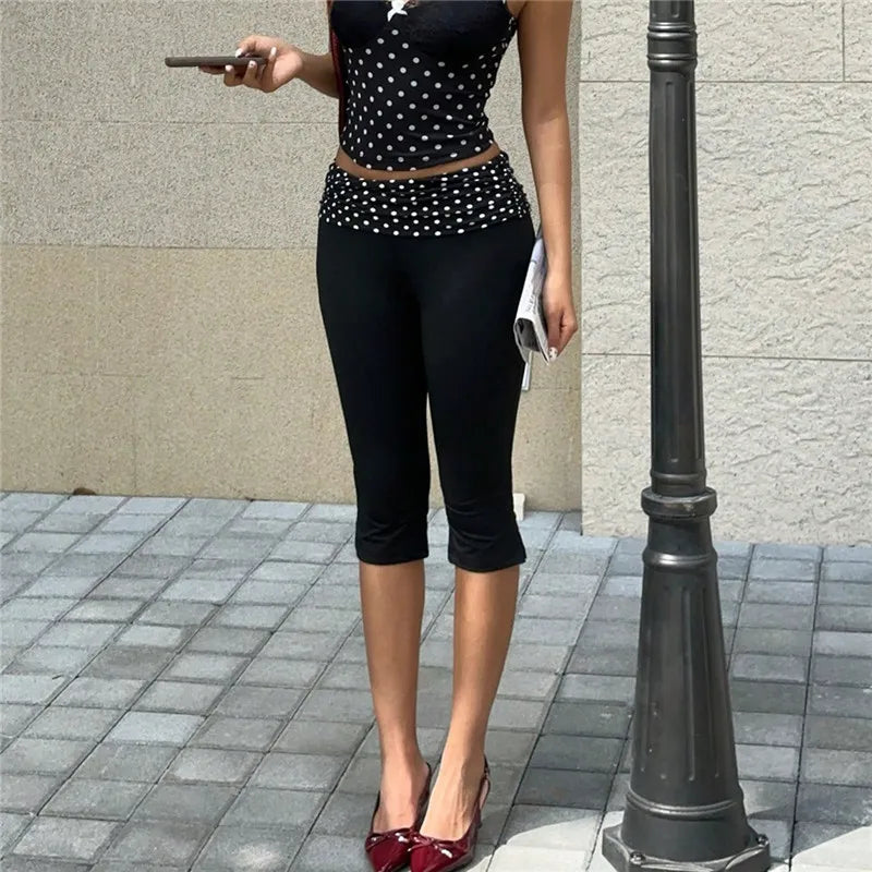 Women's black capri pants with polka dot dots design, perfect for casual outings