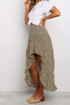 Stylish women's polka dot ruffled maxi skirt with high-low hem for trendy summer outfits
