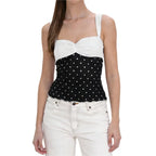 Women's polka dot top in black and white, perfect for casual outings