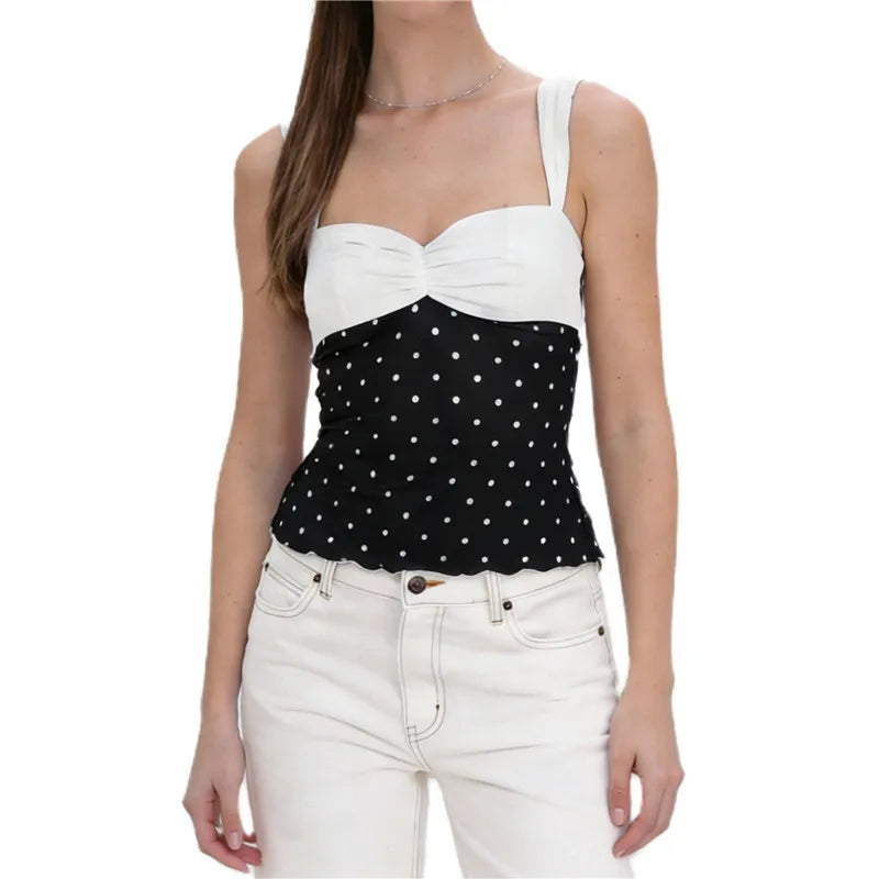 Women's polka dot top in black and white, perfect for casual outings