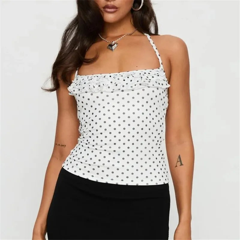 Women's white polka dot top with ruffle detailing, casual wear