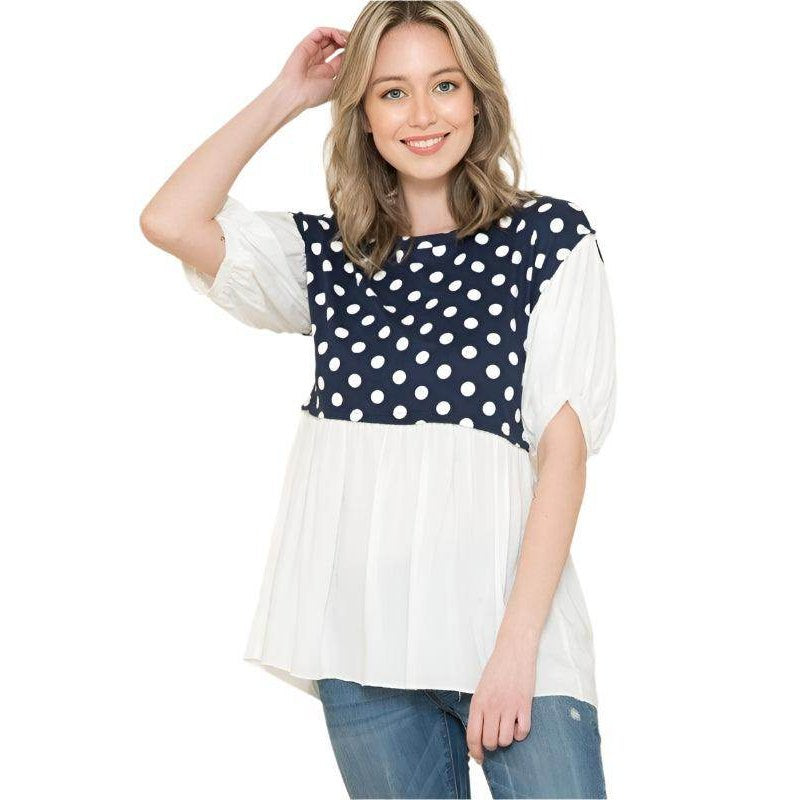 Women's polka dot tunic top with navy and white colors, featuring puff sleeves and a comfortable fit