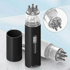 Portable scalp applicator in black, ideal for hair treatment and massage