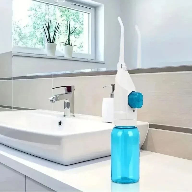 Portable water flosser for travel in blue, perfect for maintaining oral hygiene
