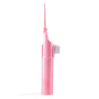 Pink portable water flosser for travel with compact design