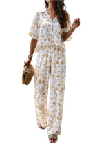 VacationGrabs women's printed short sleeve pants set with white and beige abstract design