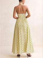 Women's yellow polka dot maxi dress, perfect for summer gatherings