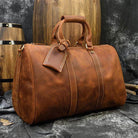Brown leather duffel bag by VacationGrabs, ideal professional business travel bag with sturdy handles