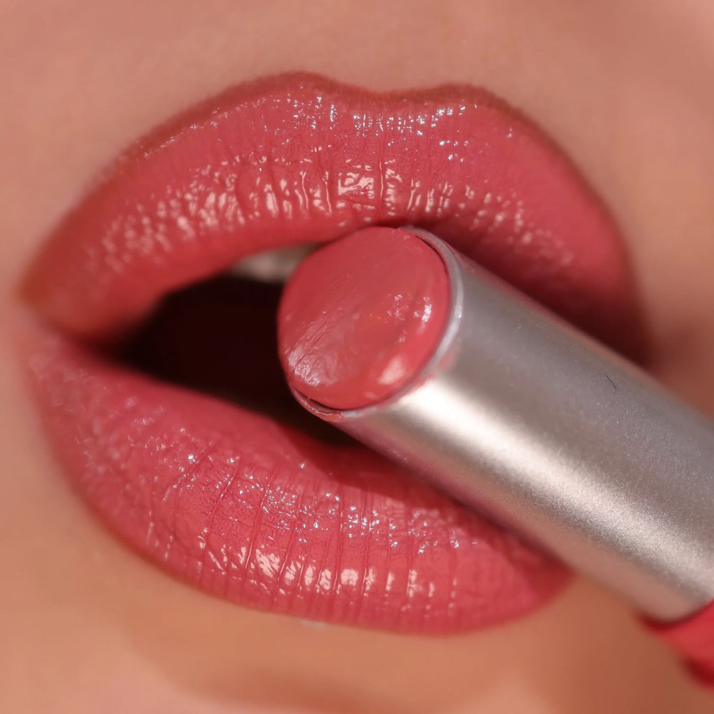 VacationGrabs lip gloss in soft pink, perfect for everyday wear