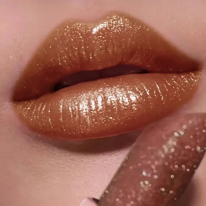 Pearlescent lipstick in warm gold shade for glamorous lips