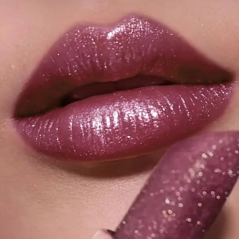 Pearlescent lipstick in a soft pink shade for a shimmering finish