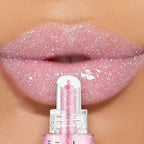 VacationGrabs lip gloss in sparkling pink for a shiny finish