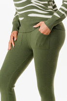 Stylish pullover sweater and pant set for women in green, featuring a modern design and pockets