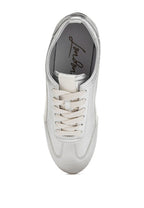 Women's metallic lace-up sneakers in silver, stylish for casual wear