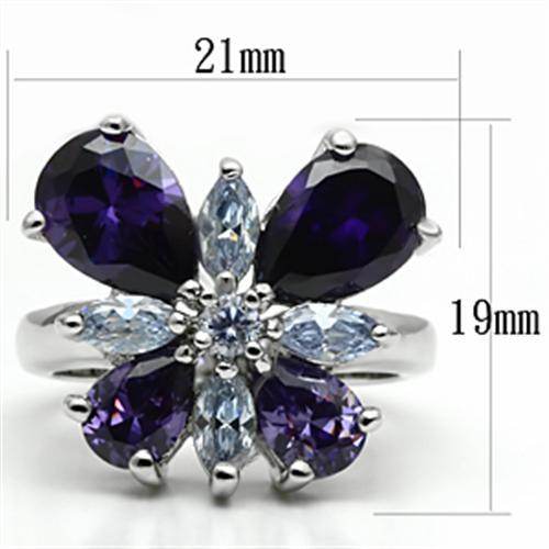 Purple butterfly statement ring featuring purple and blue gemstones in a floral design